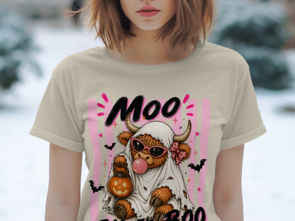 Highland cow in ghost costume holding pumpkin, with text "Moo Boo".