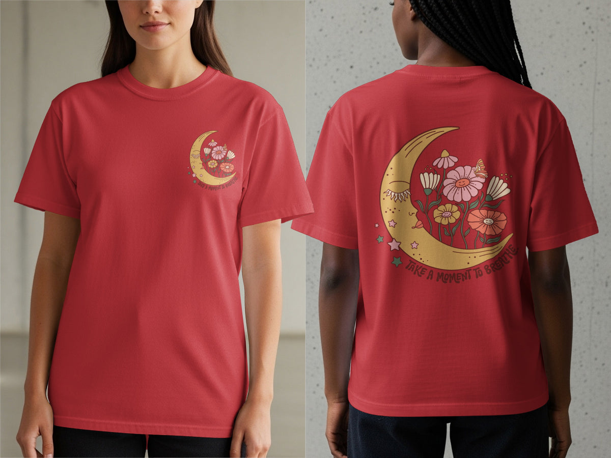 Red t-shirt with a crescent moon, flowers, and "take a moment to breathe" text graphic.
