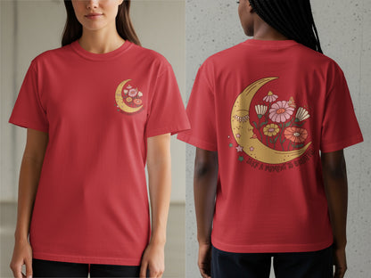 Red t-shirt with a crescent moon, flowers, and "take a moment to breathe" text graphic.