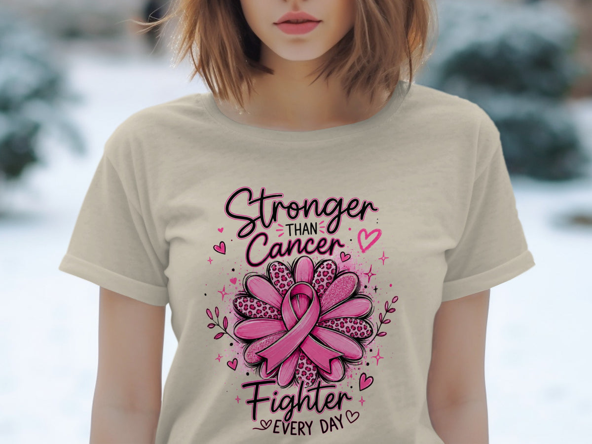 T-shirt with "Stronger Than Cancer Fighter Every Day" and pink ribbon flower graphic.