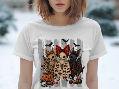 Three cartoon bats with Halloween decorations stand in front of gray stripes.