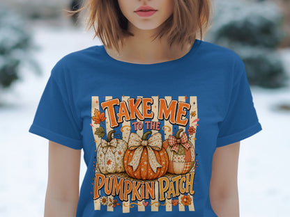 "Take Me to the Pumpkin Patch" text with three decorated pumpkins on a blue t-shirt.