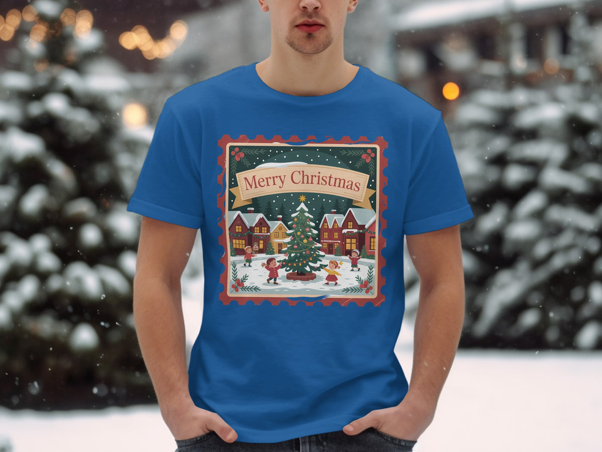 Blue t-shirt featuring a festive Christmas scene with children and a tree, saying "Merry Christmas".