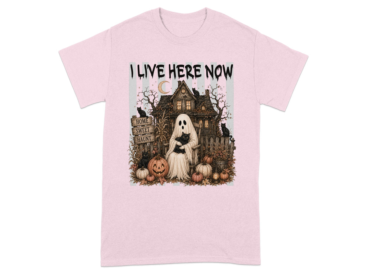 I LIVE HERE NOW text above ghost and haunted house scene with pumpkins and cats.