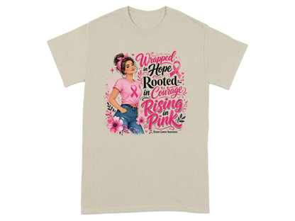 Woman in pink shirt with breast cancer awareness text and ribbons.
