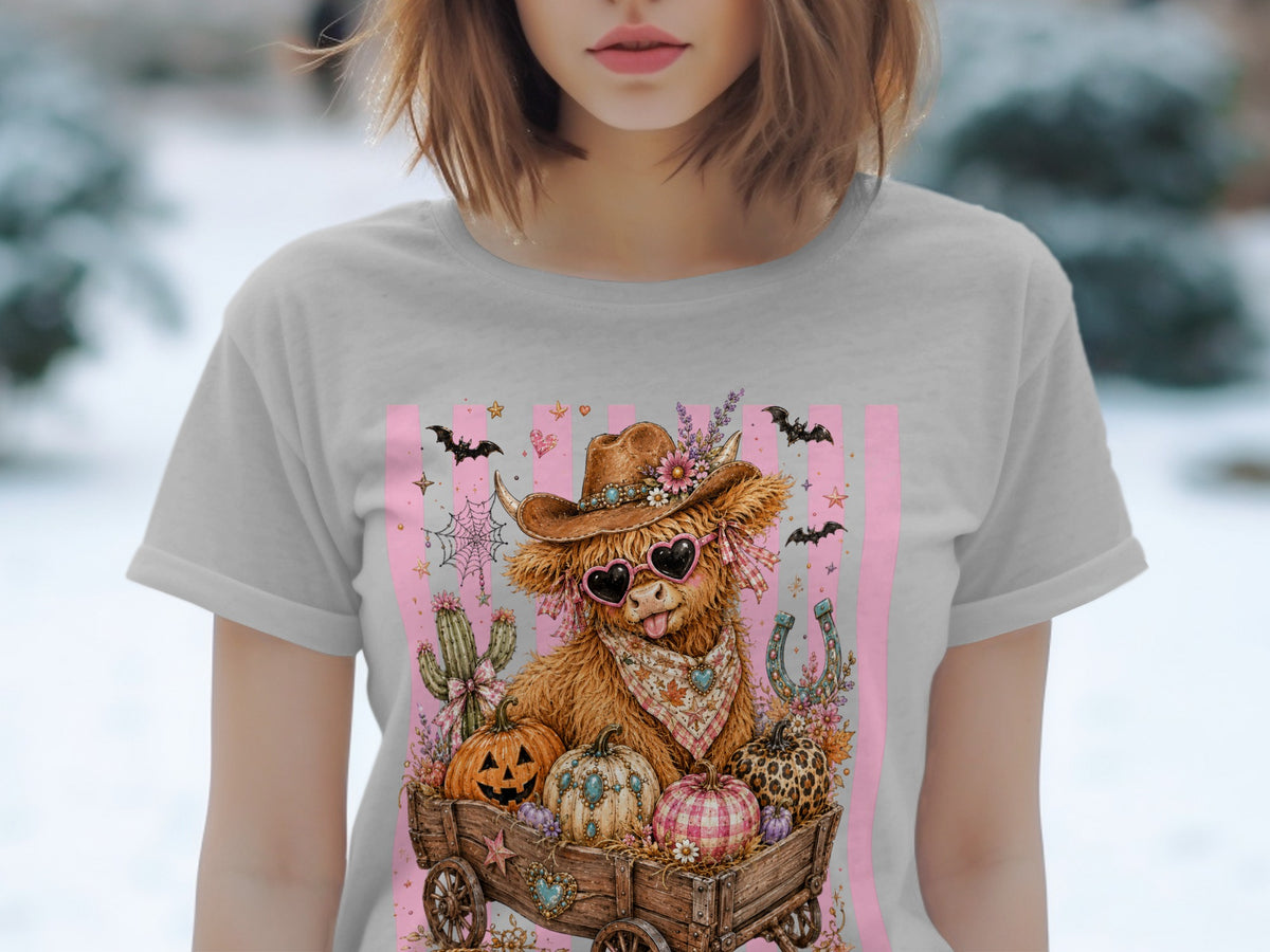 Cow with heart sunglasses and cowboy hat in a wagon full of pumpkins.