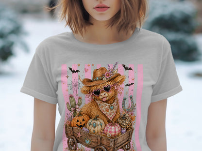 Cow with heart sunglasses and cowboy hat in a wagon full of pumpkins.