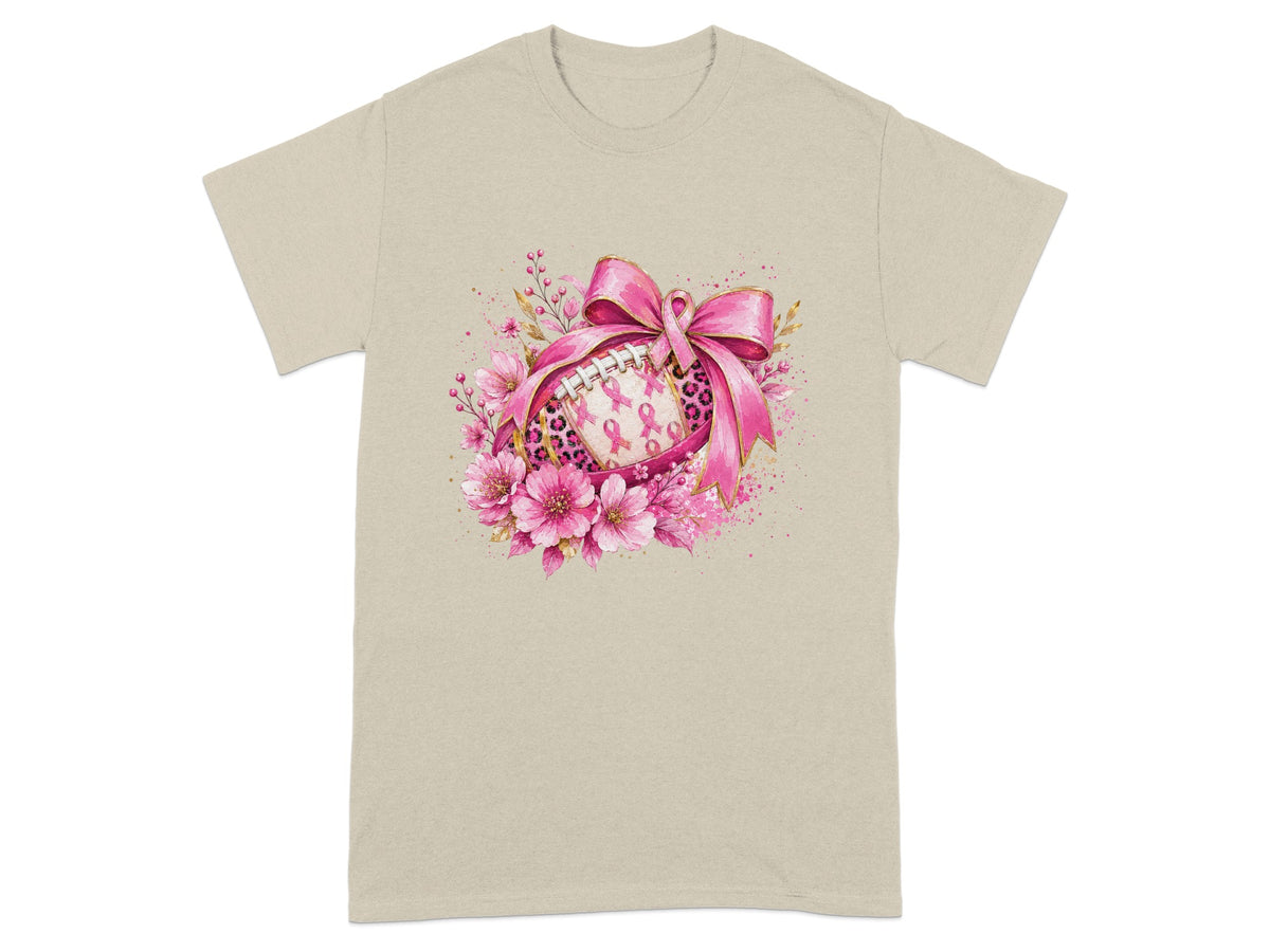 Football adorned with pink ribbons and flowers on a tan t-shirt.