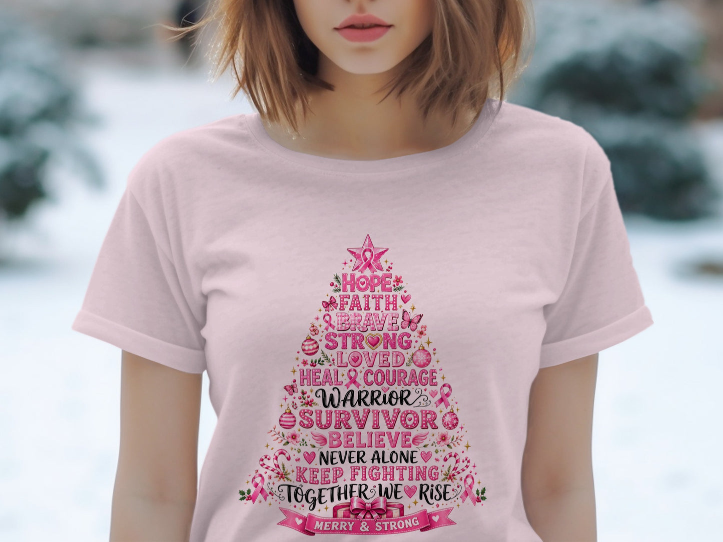Pink t-shirt with Christmas tree graphic and breast cancer awareness messages.