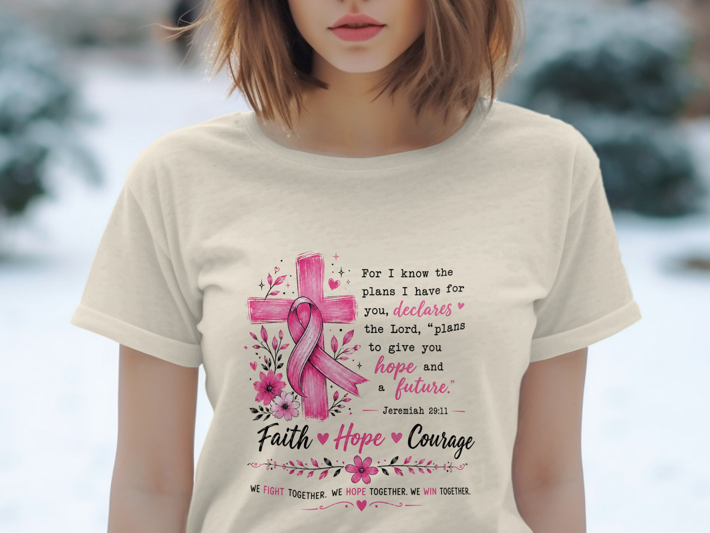 Cream t-shirt with pink cross, ribbon, flowers, and inspirational text about hope.