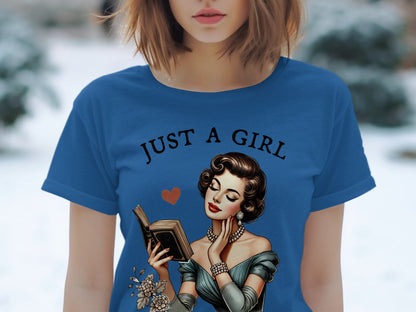 Blue t-shirt with "JUST A GIRL" and vintage illustration of woman reading