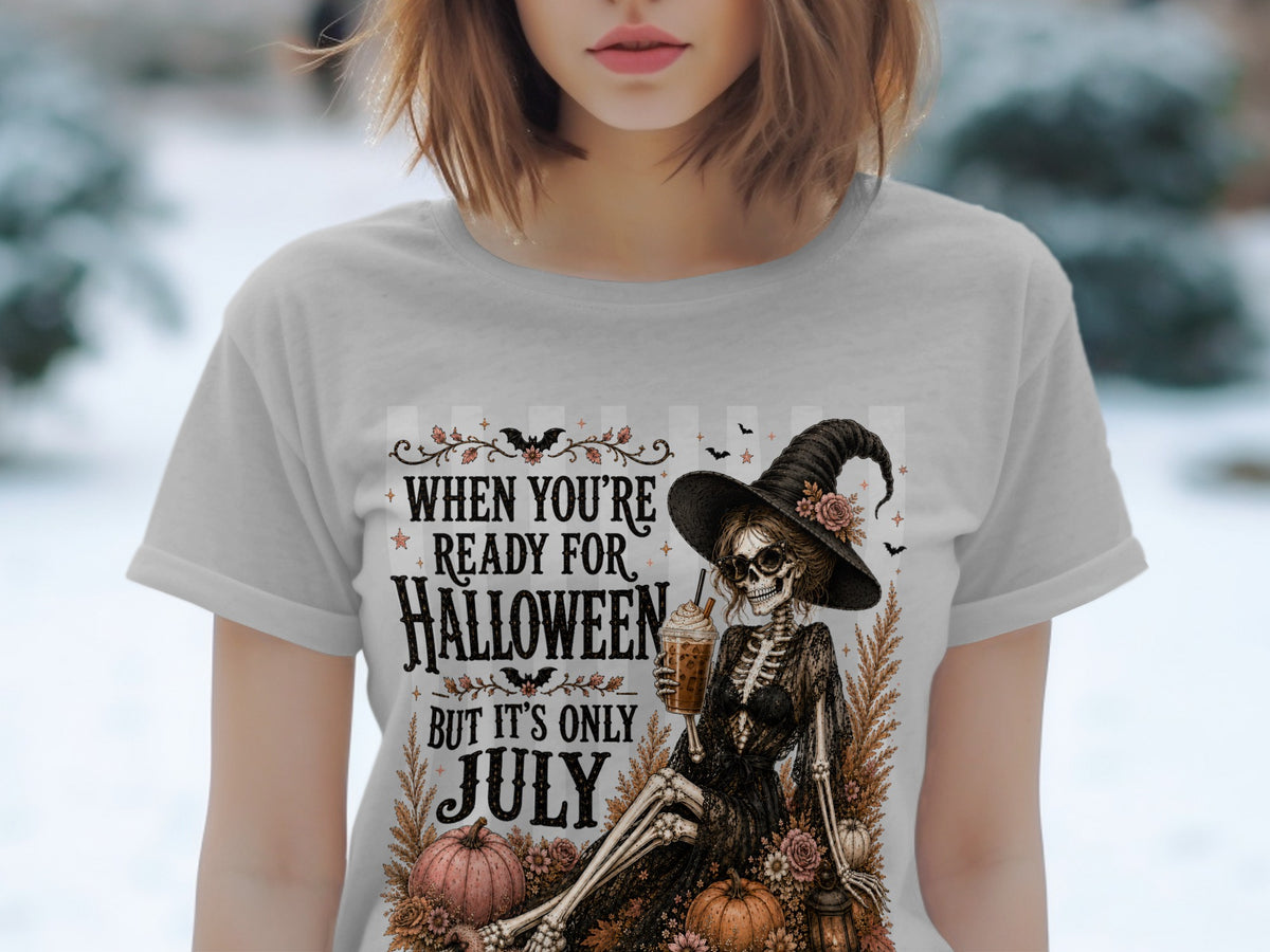 Skeleton witch with drink and text "When You're Ready for Halloween But It's Only July".