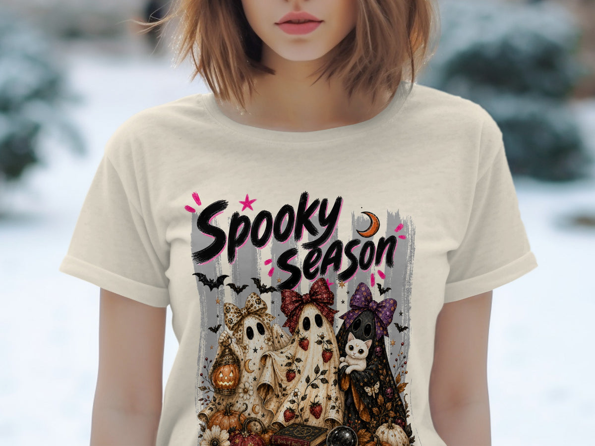 Cream t-shirt with "Spooky Season" text and cute ghosts, cat, and Halloween elements.