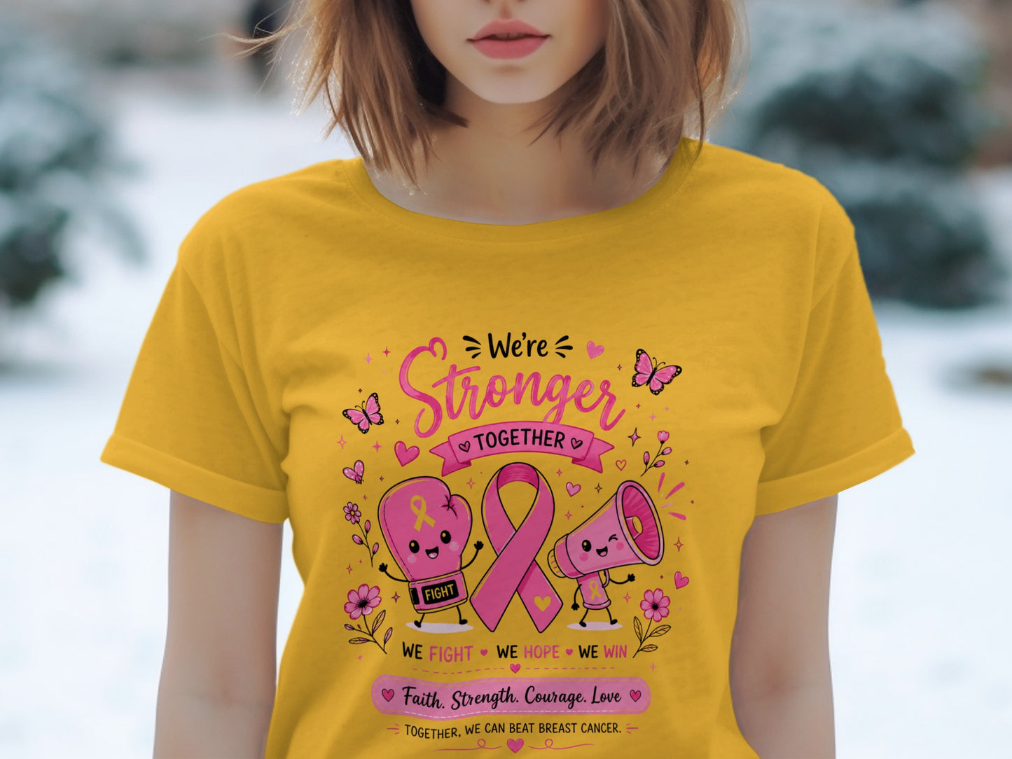 Yellow t-shirt with "We're Stronger Together" and breast cancer awareness graphics.