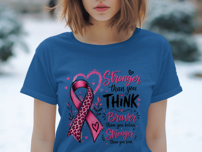 Blue t-shirt with pink ribbon and text: Stronger than you THINK, Braver than you believe, Stronger than you seem.
