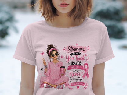 Pink t-shirt with illustration of a woman and breast cancer awareness text.
