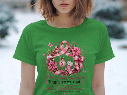 Green t-shirt with wreath graphic, pink ribbon, and text "Hope Lights the Season TOGETHER WE FIGHT".