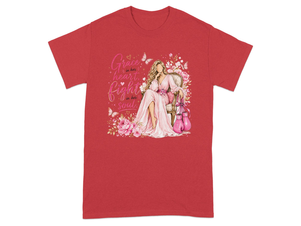 Red t-shirt with graphic of woman in pink dress, pink boxing gloves, flowers, and butterflies. Text: "Grace in her heart, fight in her soul."