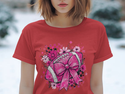 Red t-shirt with a pink football design, bow, and flowers.