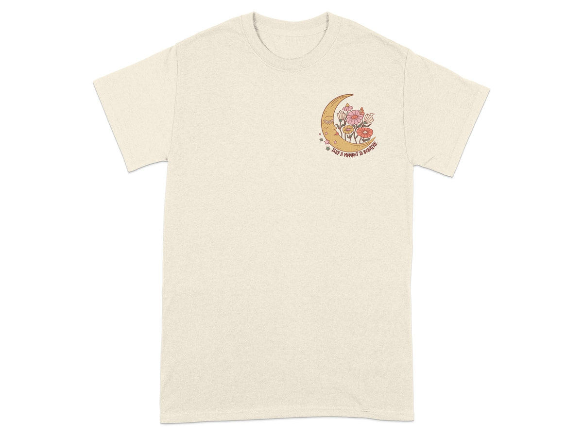 Cream t-shirt with crescent moon, flowers, and text "Take a moment to breathe".