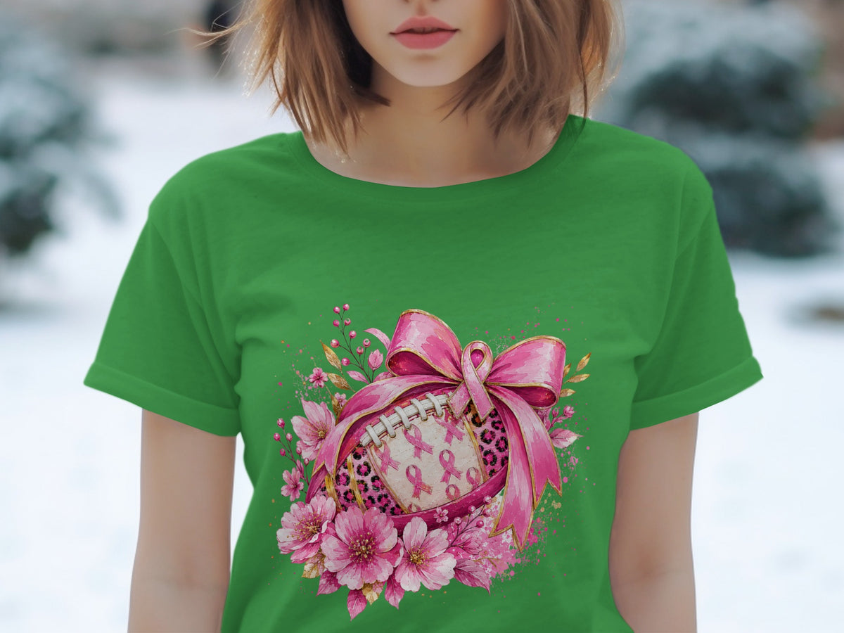Green t-shirt with a football design featuring pink ribbons, leopard print, and flowers.
