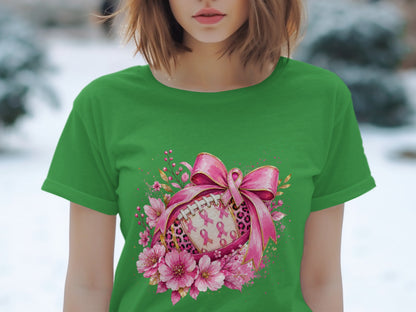 Green t-shirt with a football design featuring pink ribbons, leopard print, and flowers.