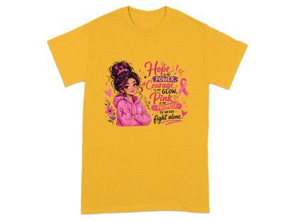 Yellow t-shirt with girl graphic and text "Hope is my power, Courage is my glow, Pink is my promise, to never fight alone."