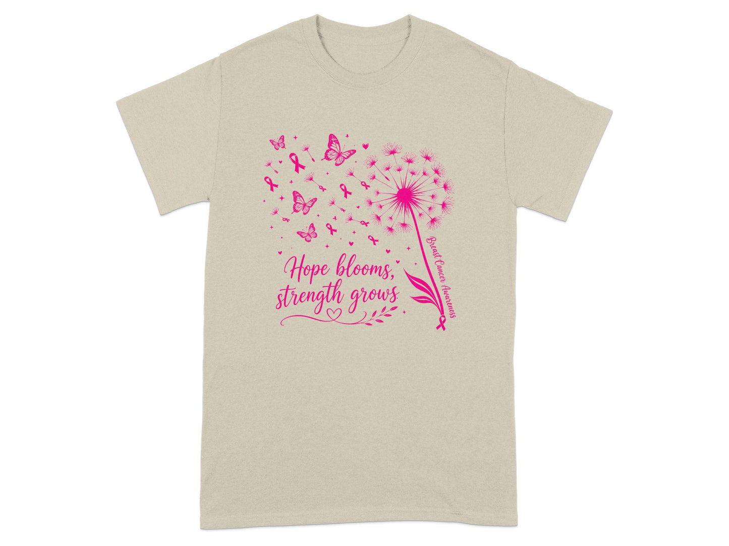 Tan t-shirt with pink dandelion, butterflies, ribbons, and text "Hope blooms, strength grows."