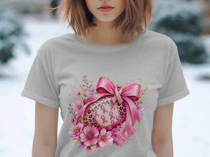 Gray t-shirt with a pink ribbon football and floral design.
