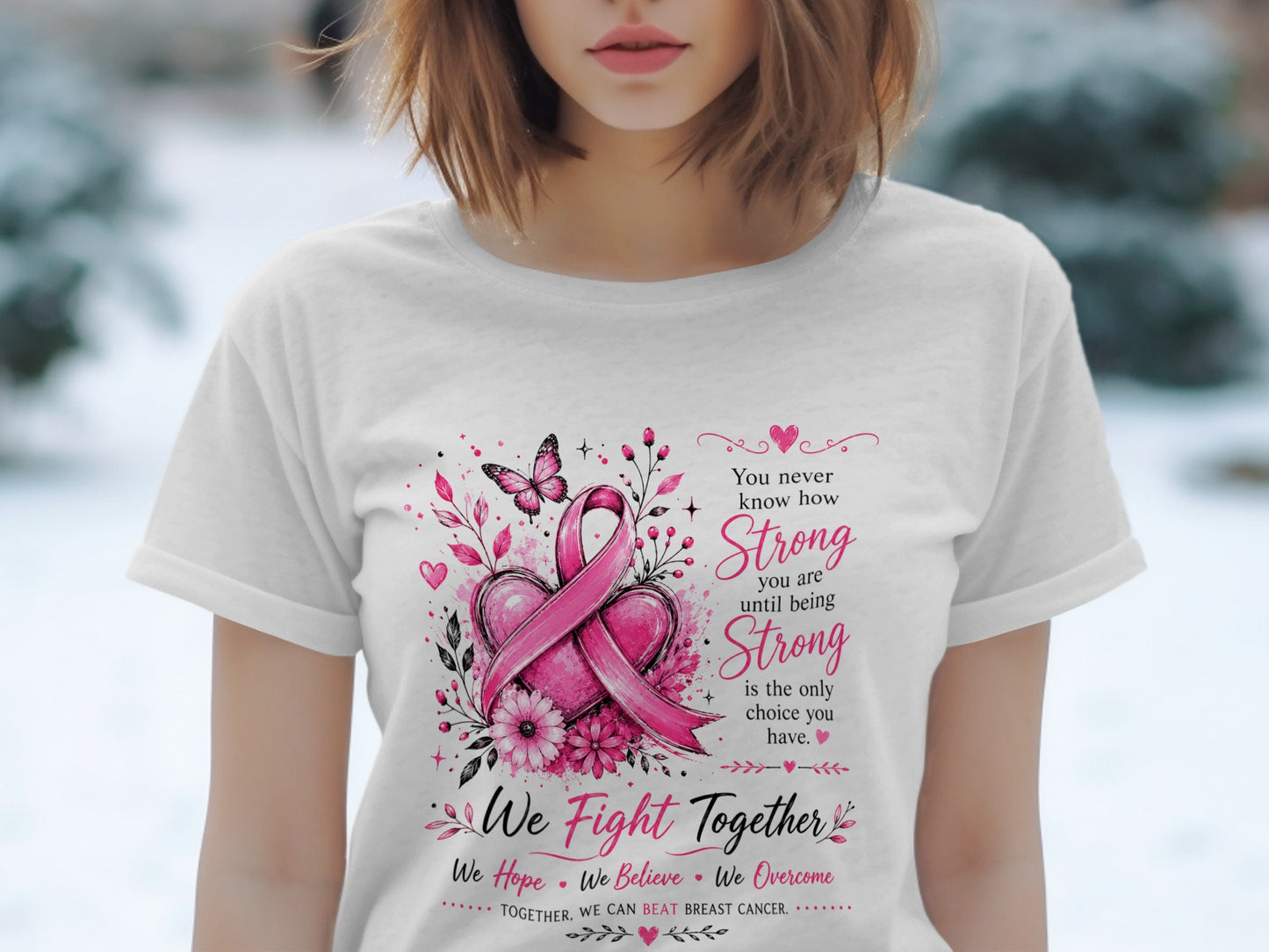 White t-shirt with pink breast cancer ribbon, hearts, flowers, and inspirational text.