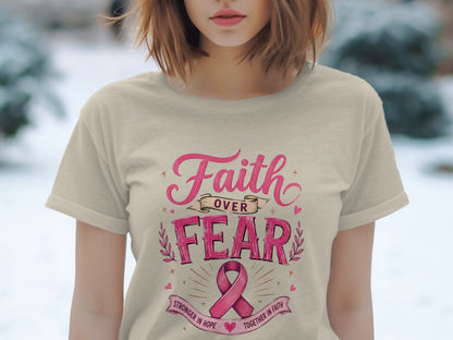Light beige t-shirt with pink "Faith Over Fear" graphic and ribbon.