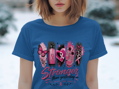 Blue t-shirt with "Stronger than yesterday" text and pink breast cancer awareness icons.