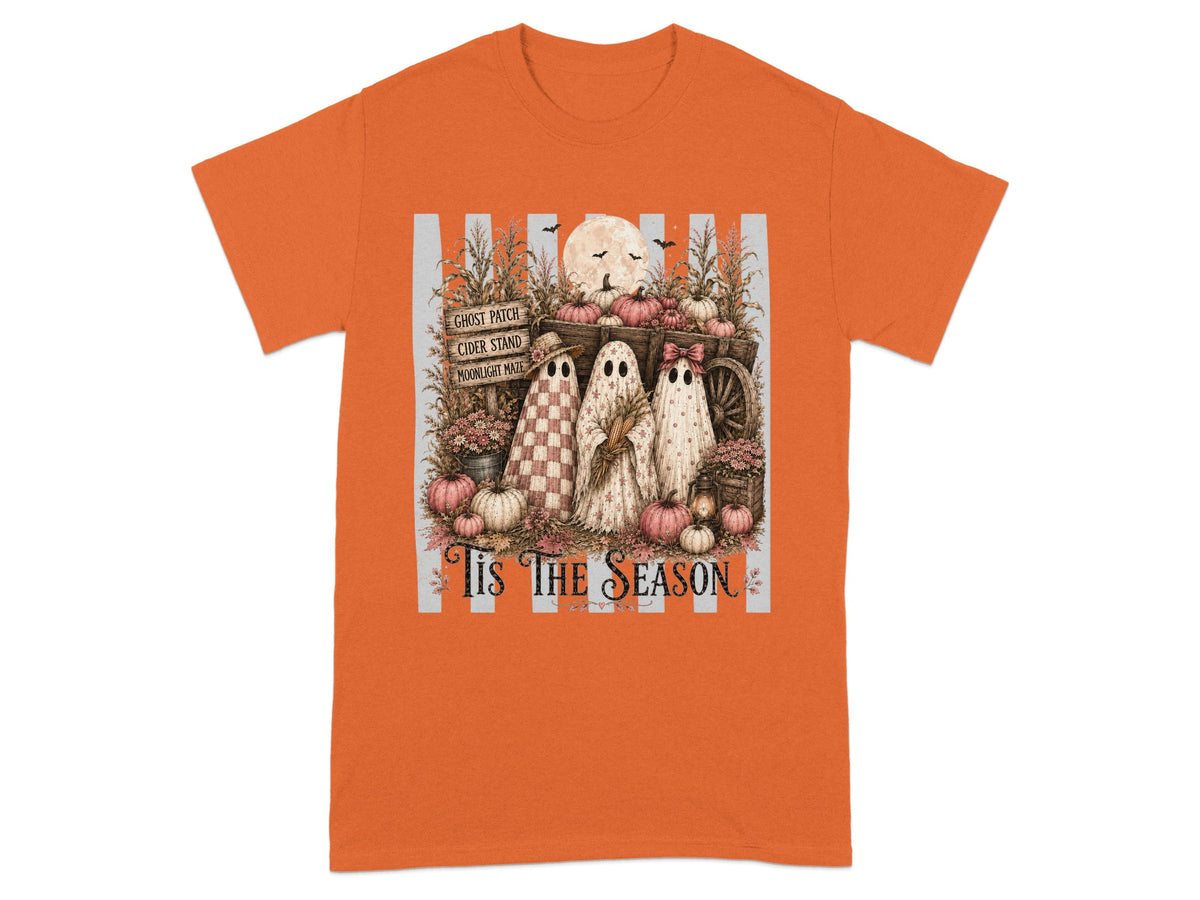 Three ghosts in a wagon with pumpkins and a sign that reads "Tis The Season".