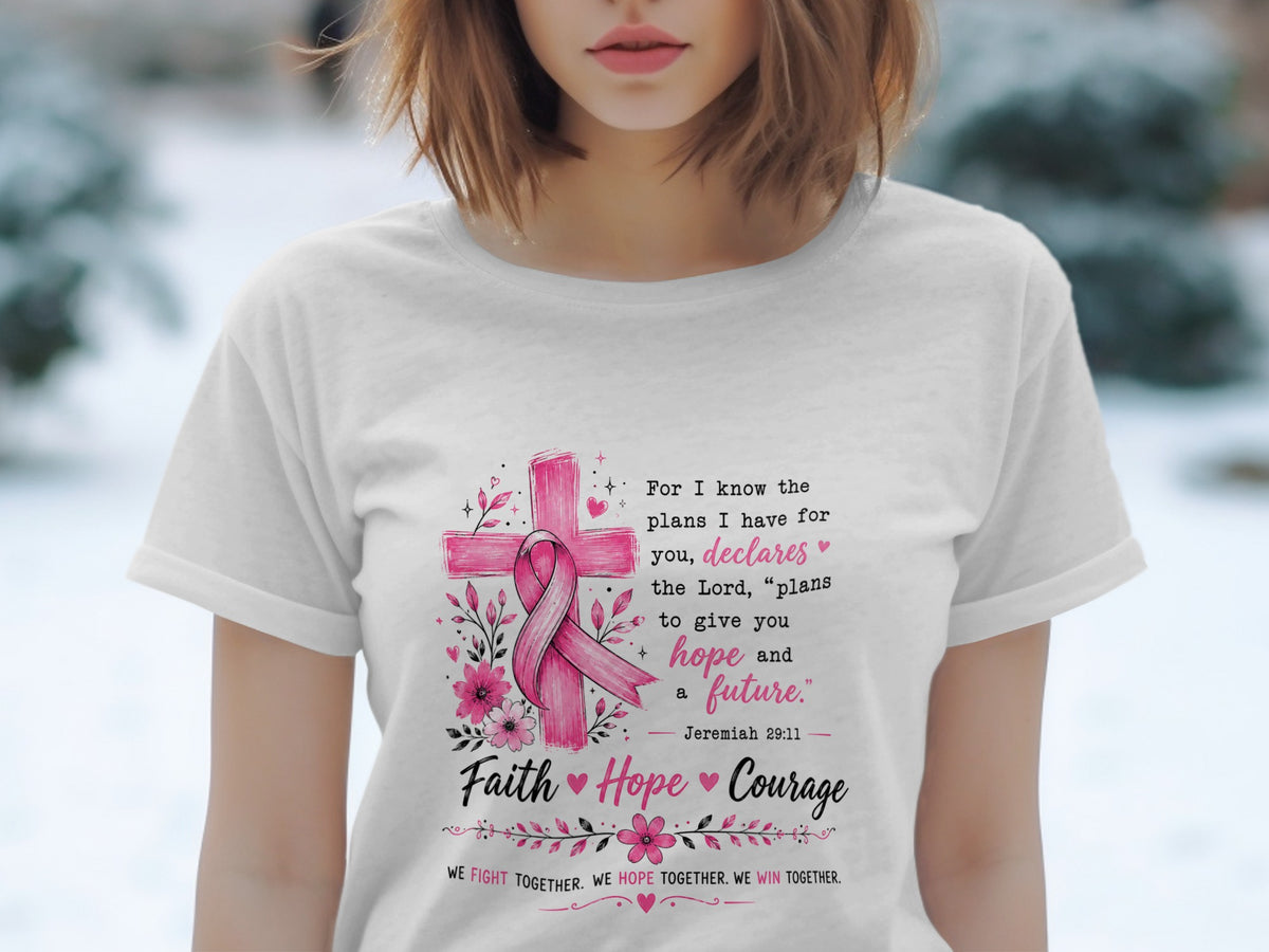White t-shirt with pink cross, ribbon, flowers, and inspirational text.