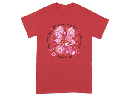 Red t-shirt with circular breast cancer awareness design featuring pink bows and text.