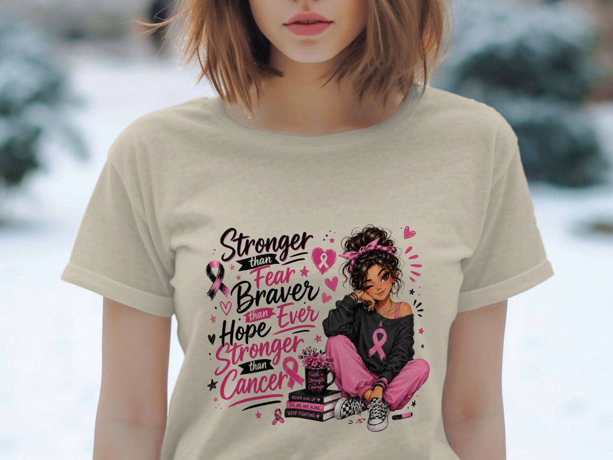 T-shirt with "Stronger than Fear, Braver than Hope, Stronger than Cancer" and breast cancer ribbons.