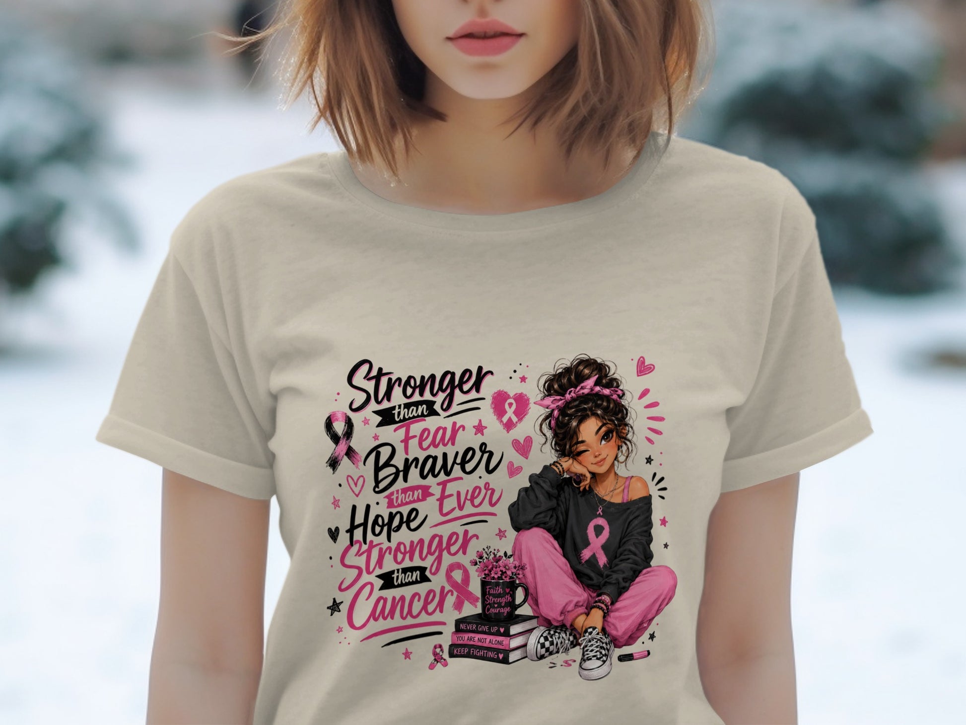 T-shirt with "Stronger than Fear, Braver than Hope, Stronger than Cancer" and breast cancer ribbons.
