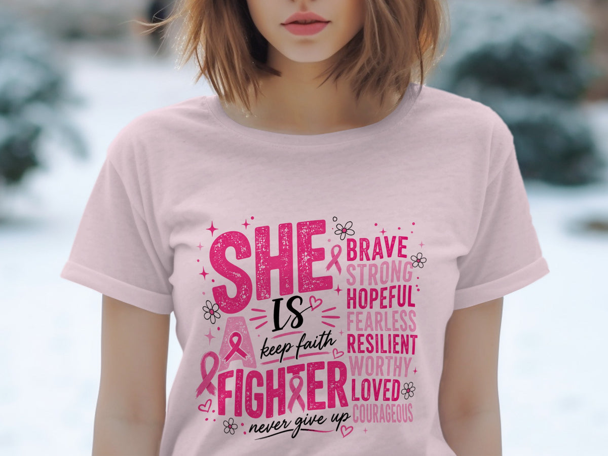 Pink t-shirt with "SHE IS a FIGHTER" and descriptive words like Brave, Strong, Hopeful.