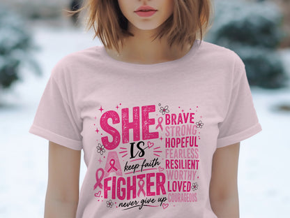 Pink t-shirt with "SHE IS a FIGHTER" and descriptive words like Brave, Strong, Hopeful.