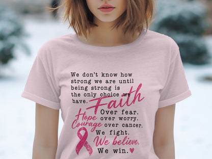 Pink t-shirt with text about strength, faith, hope, courage, and winning against cancer.