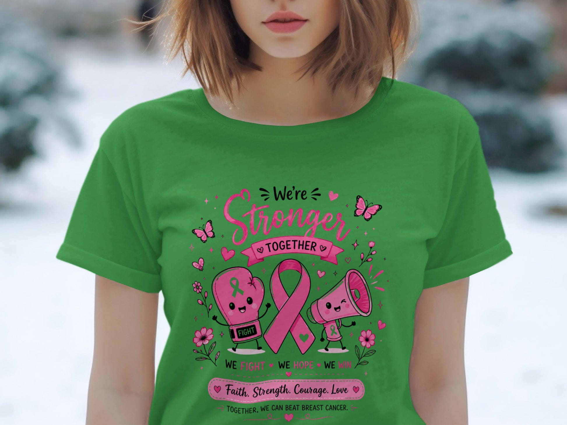 Green t-shirt with "We're Stronger Together" and breast cancer awareness graphics.