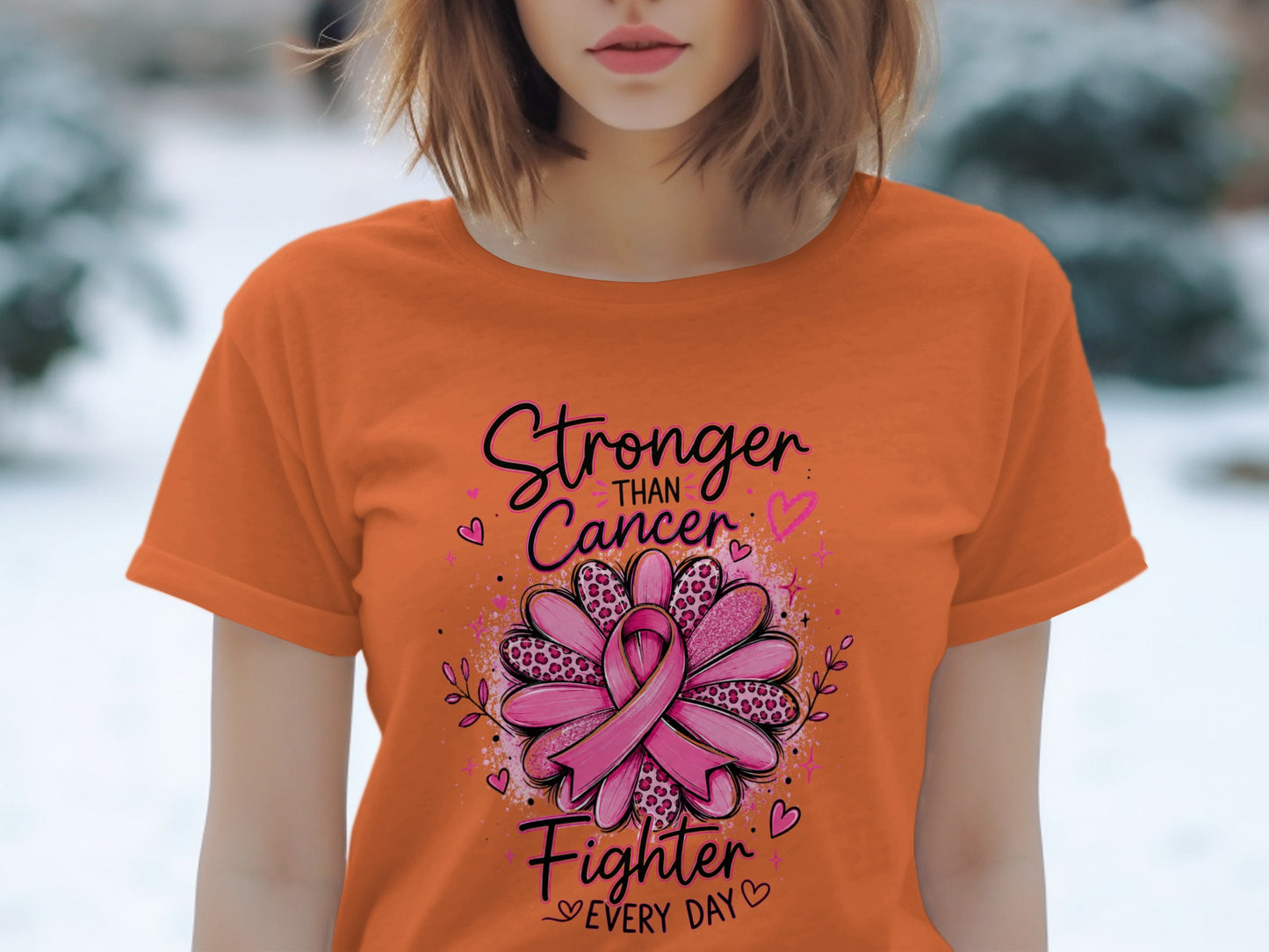 Orange t-shirt with "Stronger Than Cancer Fighter Every Day" and a pink ribbon.