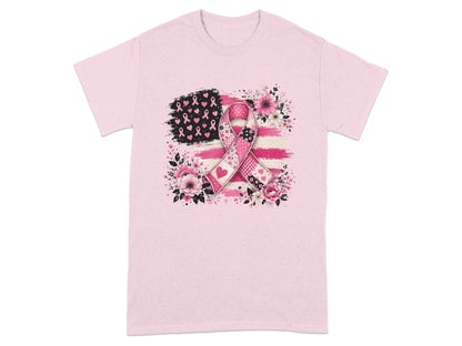 Pink t-shirt with a distressed US flag, a patchwork ribbon, and floral elements.
