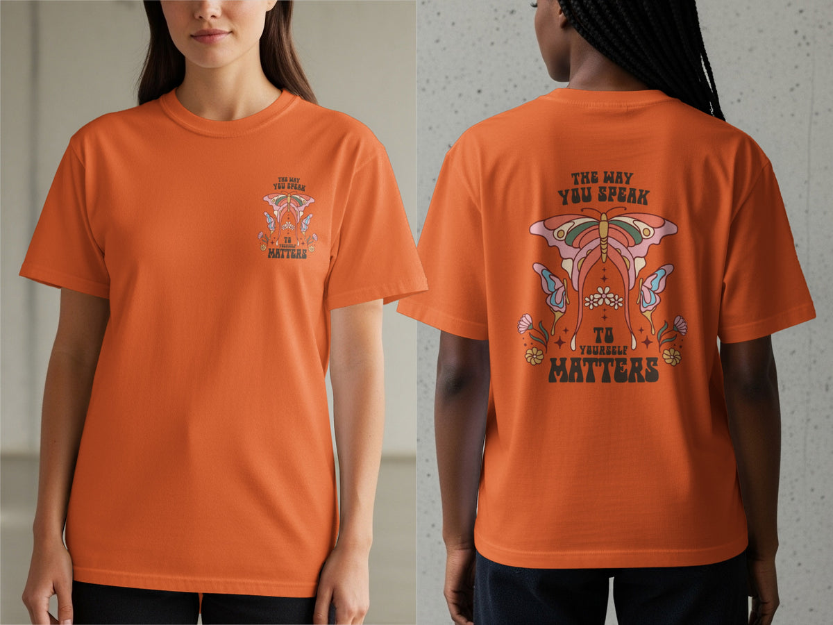Orange t-shirt with graphic of butterfly and text "The Way You Speak To Yourself Matters".