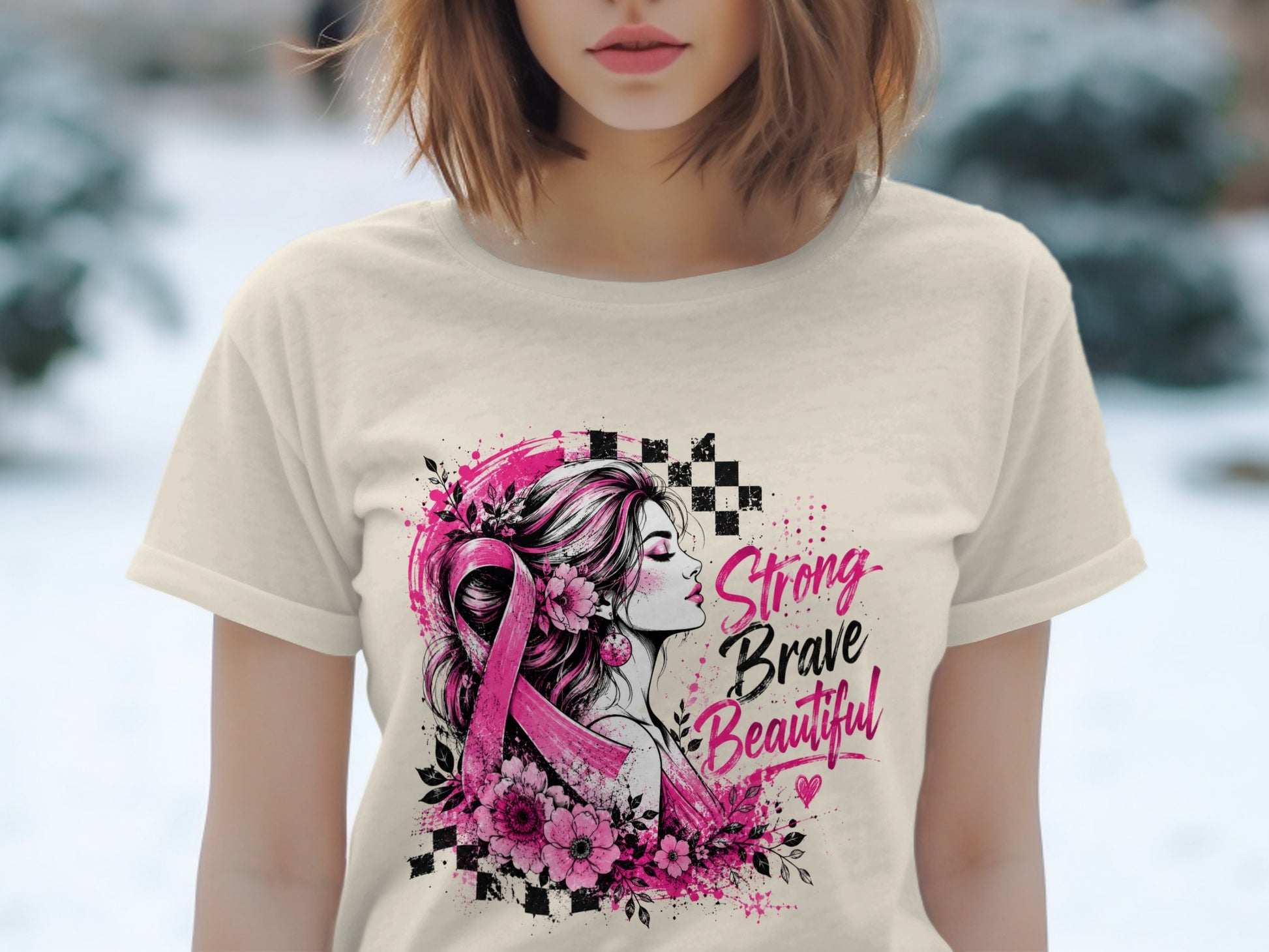 T-shirt with graphic of woman, pink ribbon, flowers, and text "Strong Brave Beautiful".