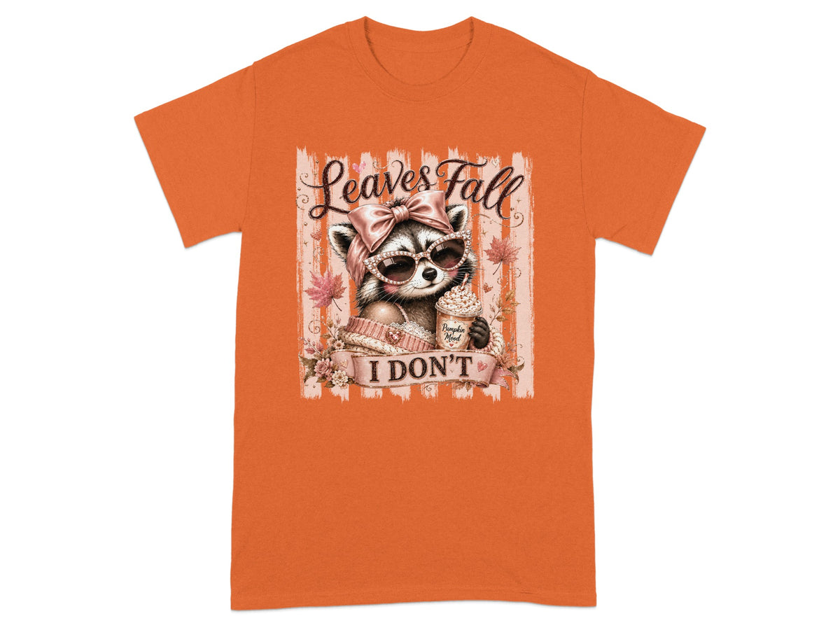 T-shirt graphic with raccoon wearing sunglasses and holding pumpkin spice latte, "Leaves Fall I Don't" text.