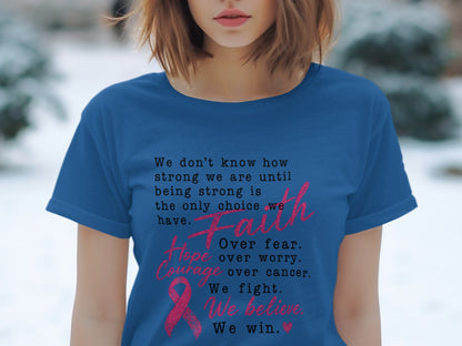 Blue t-shirt with inspirational text about strength and faith, featuring a pink ribbon.