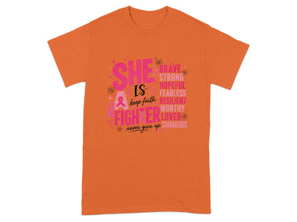 Orange t-shirt with "SHE IS A FIGHTER" text and empowering words.