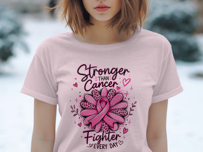 Pink t-shirt with "Stronger Than Cancer Fighter Every Day" text and pink ribbon design.