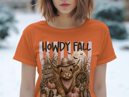 Orange t-shirt with "Howdy Fall" text and a highland cow wearing a hat.